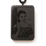 Warm light photo of custom pendants amulet necklace presented as a gift with star protection symbol | people ​planet  x star