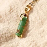 Ppxstar jadeite pendant amulet necklace gold wrap detail | people ​planet  x star