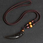 Ppxstar jewelry with obsidian wolf tooth pendant closeup | people ​planet  x star