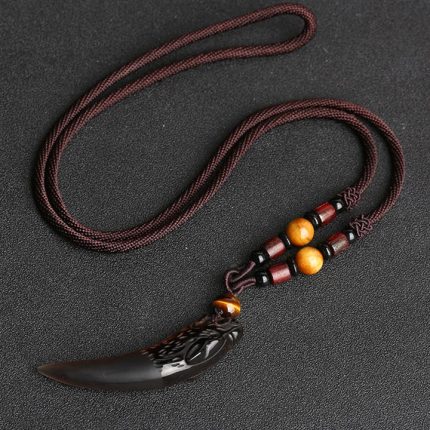 ppxstar jewelry with obsidian wolf tooth pendant closeup