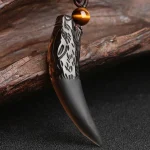 Ppxstar jewelry with obsidian wolf tooth pendant on hand | people ​planet  x star