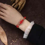 Ppxstar red string protection bracelet fortune knot detail | people ​planet  x star