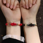 Ppxstar red string protection bracelet side angle | people ​planet  x star