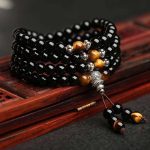Ppxstar black obsidian bracelet tiger eye beads closeup | people ​planet  x star