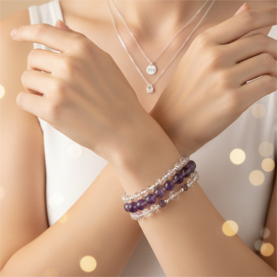 Close up of a woman wearing a 999 necklace 999 silver chain and crystal bracelets to amplify the 999 angel number energy with spiritual jewelry