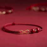 Ppxstar mother and daughter bracelet red string closeup | people ​planet  x star